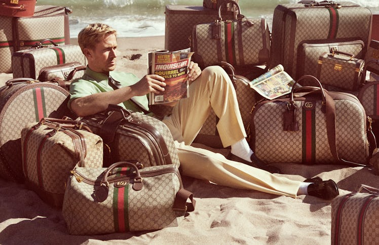 Ryan Gosling surrounded by Gucci luggage as he reads a tabloid with a headline about a squirrel