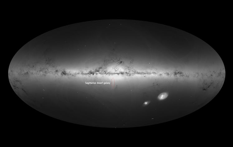 the plane of the milky way with a small circle showing the location of the sagittarius dwarf spheroi...