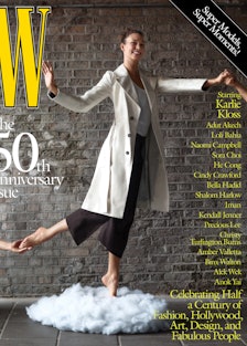 Karlie Kloss in a white coat, tank top, and black pants on the cover of W Magazine's 50th anniversar...