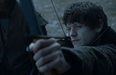 Ramsay Bolton aims a bow and arrow in Game of Thrones.