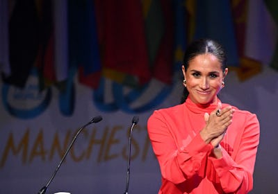 Britain's Meghan, Duchess of Sussex applauds at the end of her speech on stage during the annual One...