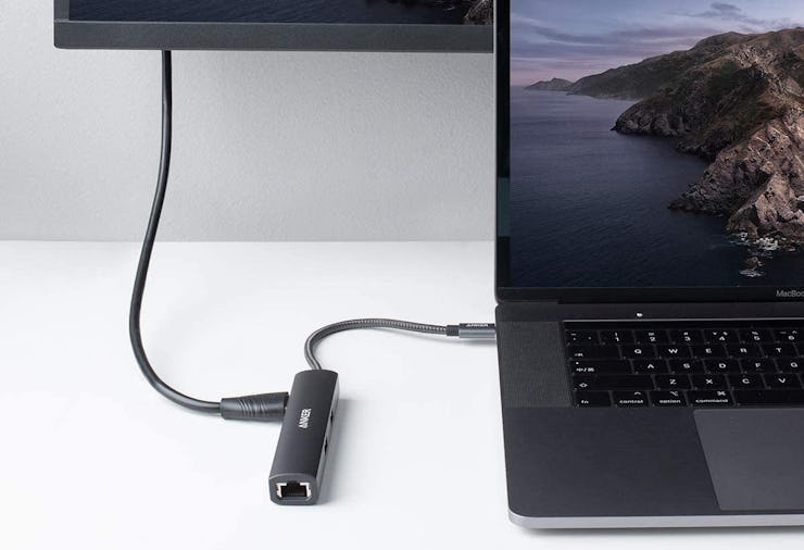 The best USB-C hubs (such as the one featured in this photo of a hub connected to the laptop sittin...
