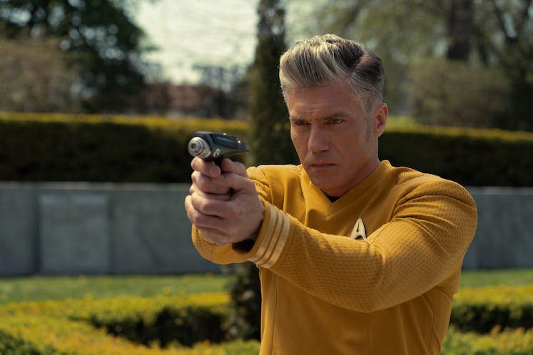 Captain Pike (Anson Mount) with a phaser in Strange New Worlds