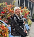 TikToker Eva Benefield in front of flowers