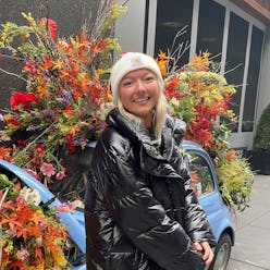 TikToker Eva Benefield in front of flowers