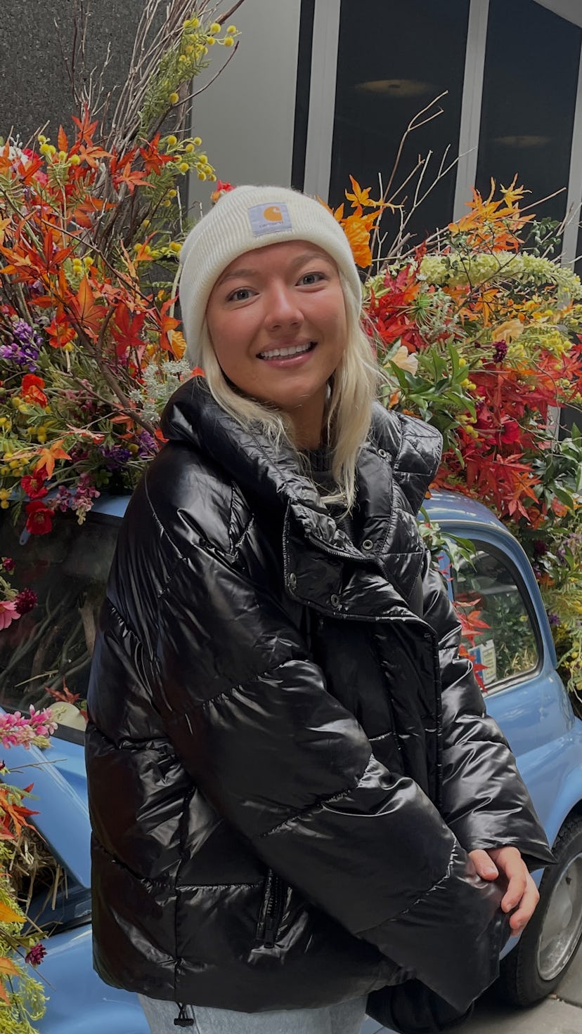 TikToker Eva Benefield in front of flowers