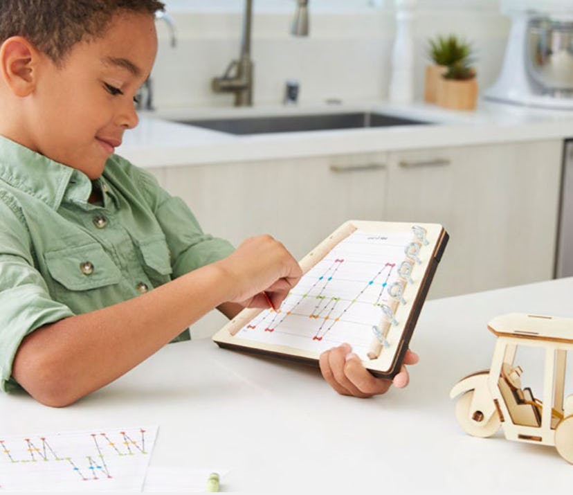 kid playing with Little Passports science box