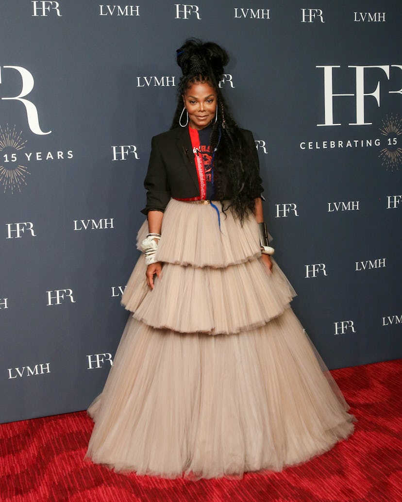 Janet Jackson wearing a tulle gown at the Harlem Fashion Row awards red carpet.