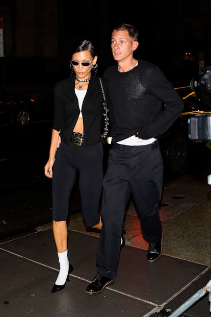 Bella Hadid (L) and Marc Kalman attends Gigi Hadid's Guest in Residence launch dinner 