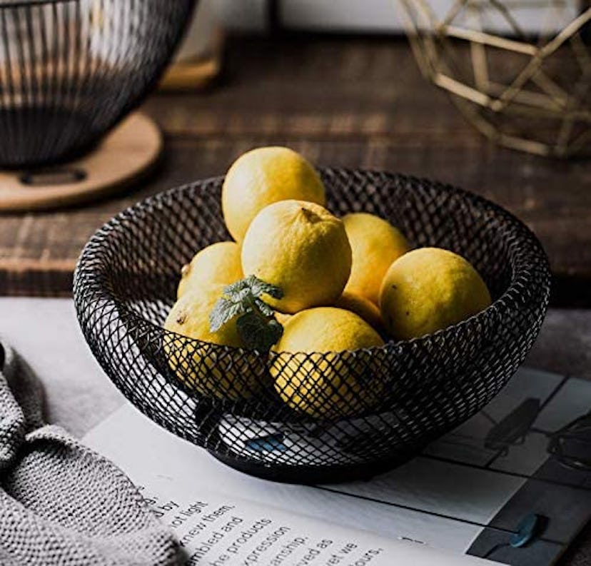 This metal wire fruit basket is perfect for holding candy on Halloween!