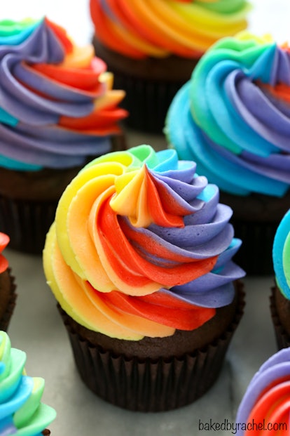 Chocolate cupcakes with rainbow buttercream frosting for rainbow baby shower.