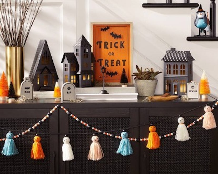 A display of some of the best Halloween decorations at Target in 2022 including a trick-or-treat sig...