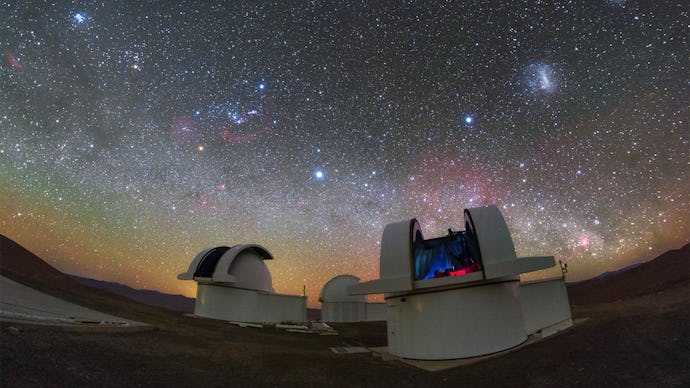 Telescopes pointed at a star studded sky.