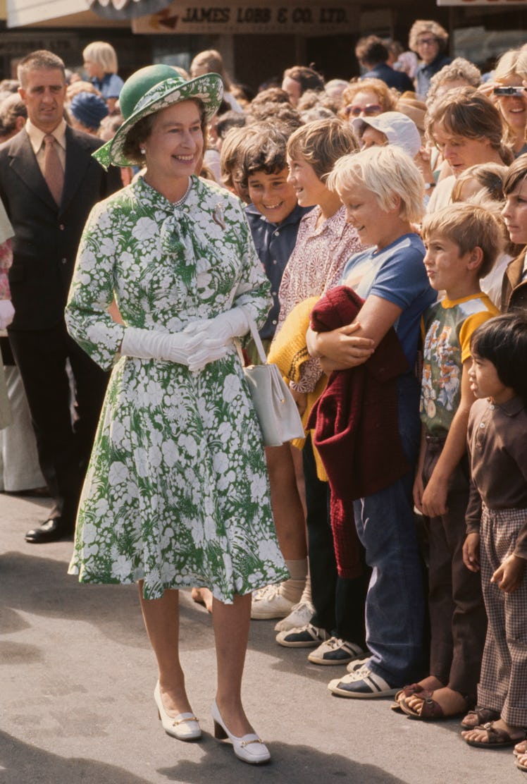 Queen Elizabeth wearing a patterned green dress
