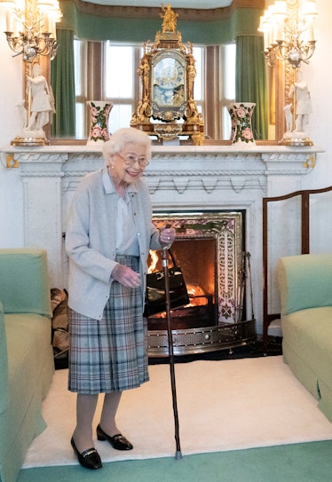 Queen Elizabeth II with a walking cane