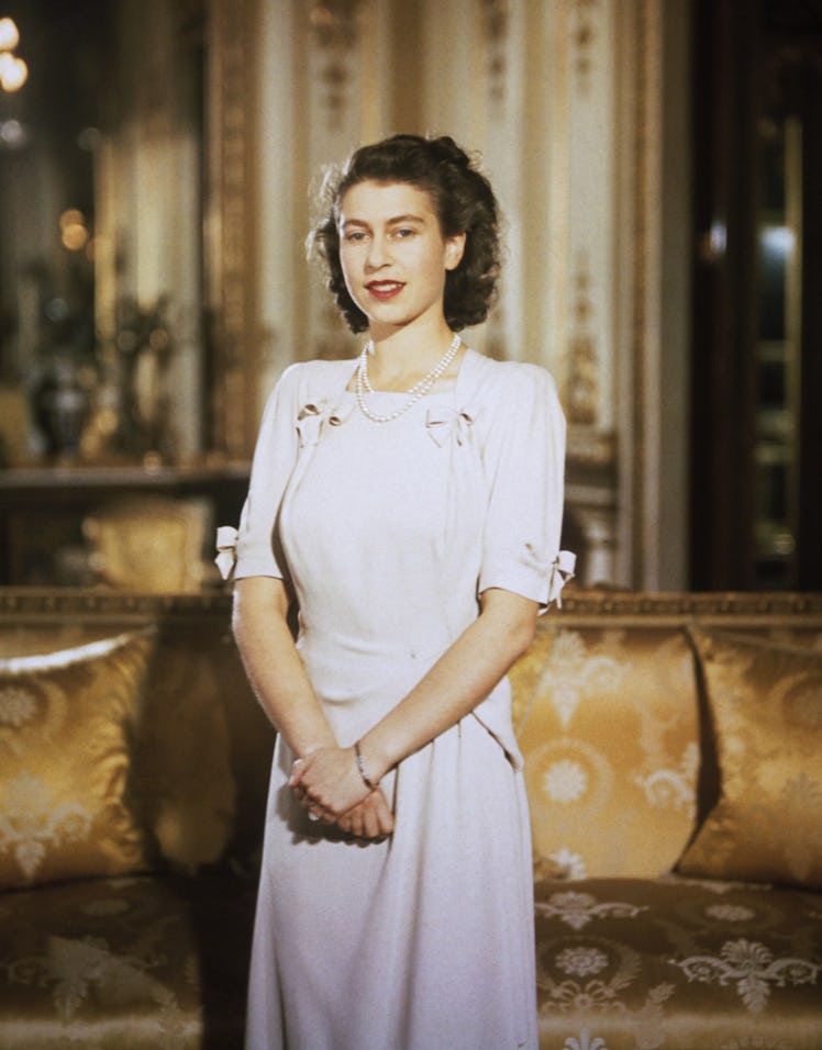 A newly engaged Queen Elizabeth II wearing a white dress
