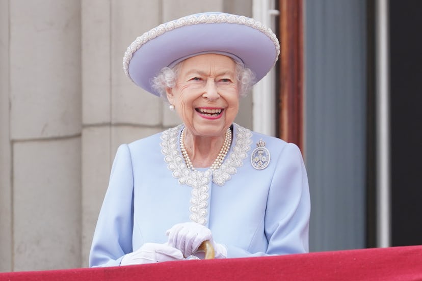 Queen Elizabeth II wearing pale blue and smiling