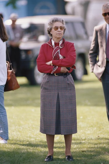 Queen Elizabeth II's Greatest Style Minutes: A Visual History 12 Queen Elizabeth wearing a red top and scarf
