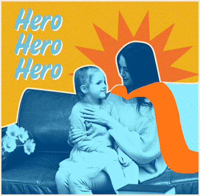 A mother sitting on a couch and keeping her child on her lap