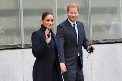 Meghan Markle and Prince Harry wearing navy