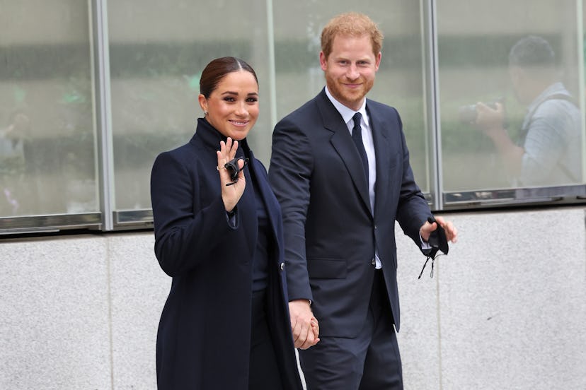 Meghan Markle and Prince Harry wearing navy