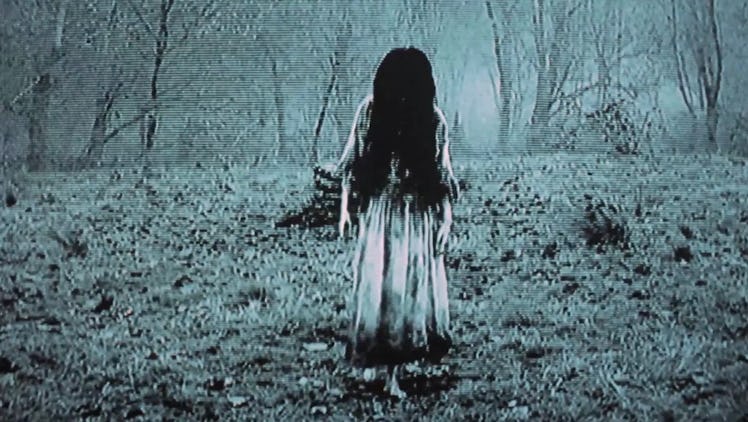 Brunette Halloween Costume: Samara from "The Ring" climbing out of her well.