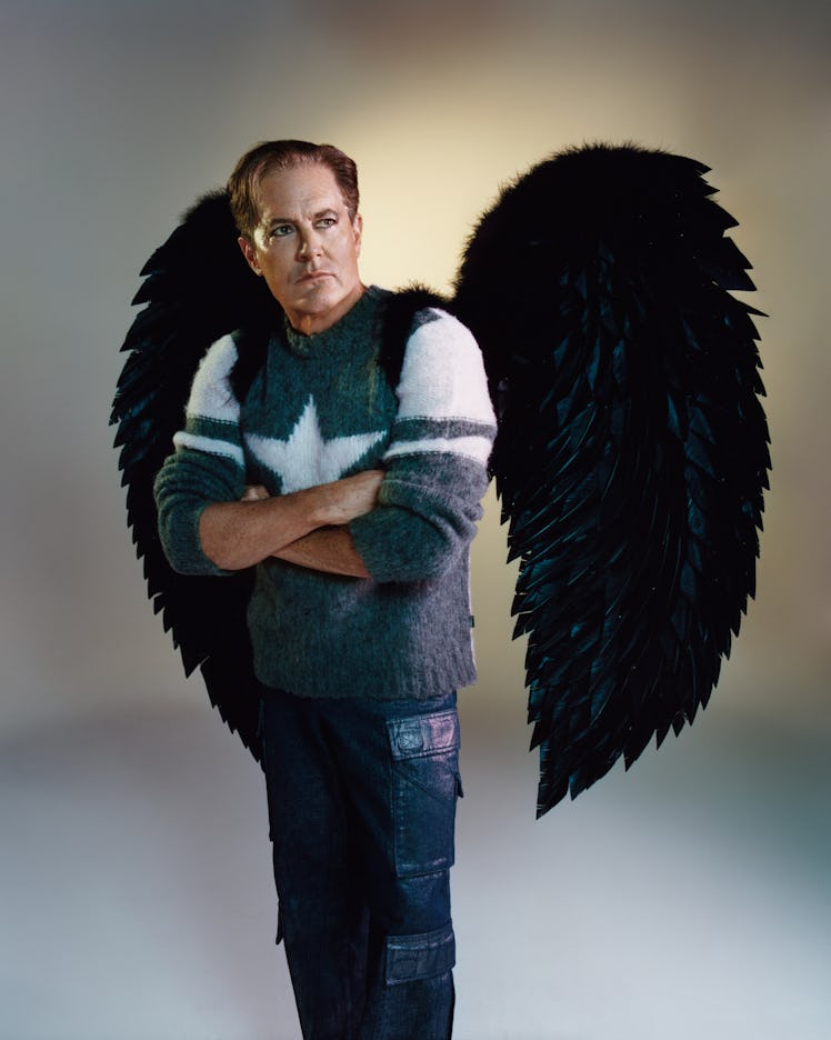 Kyle MacLachlan wearing wings in a Heaven by Marc Jacobs campaign