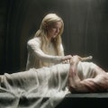 Galadriel stands next to the body of her brother, Finrod, in Episode 1 of The Lord of the Rings: The...