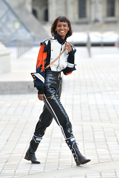 Liya Kebede at the Louis Vuitton Womenswear show as part of Paris Fashion Week in leather pants, a s...