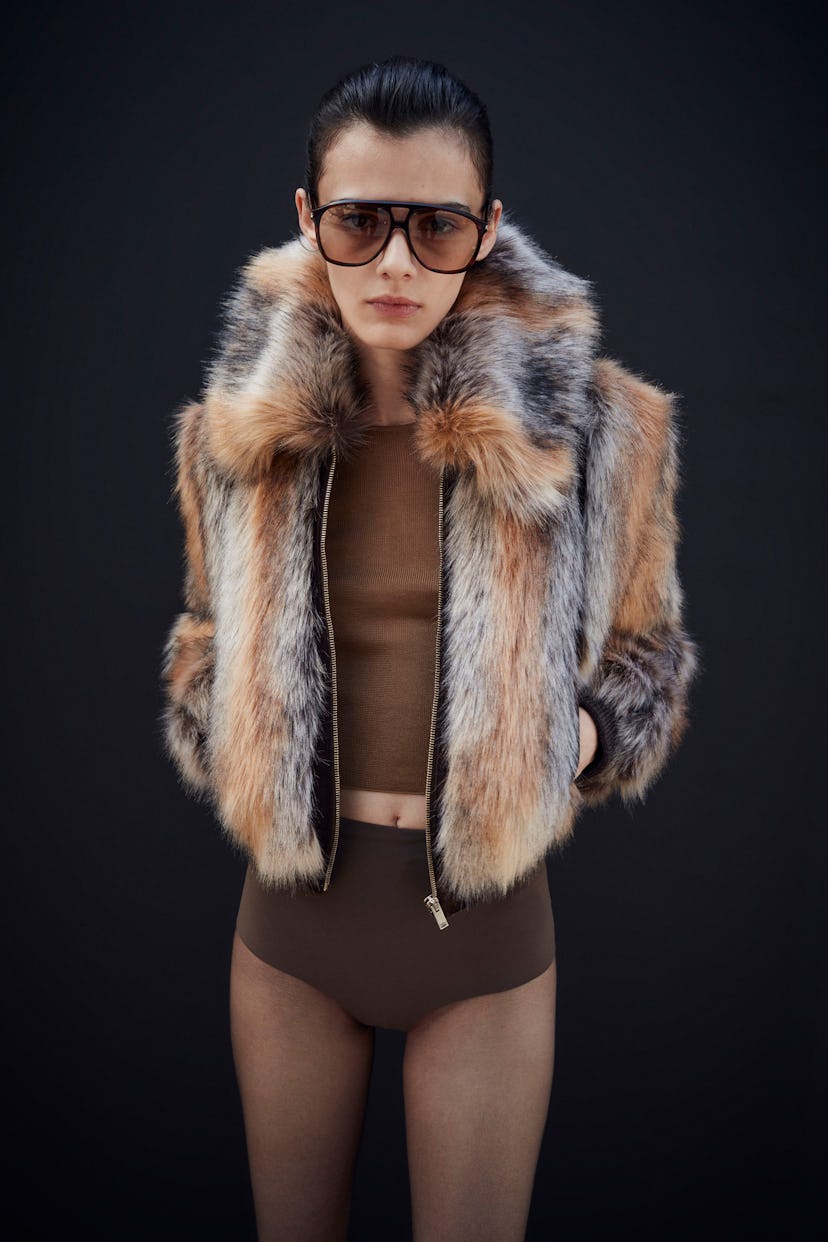 A model wearing a fur jacket from Saint Laurent's resort 2023 collection