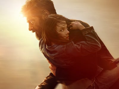 Wolverine (Hugh Jackman) carries Laura (Dafne Keen) on a poster for 2017's Logan