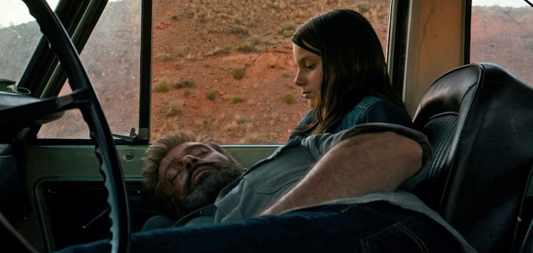 Wolverine (Hugh Jackman) sleeps in Laura's (Dafne Keen) lap in 2017's Logan