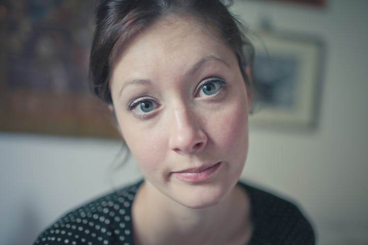 Woman staring into camera looking annoyed