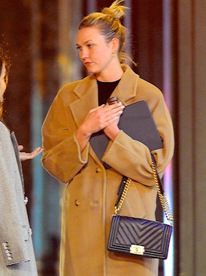 Karlie Kloss seen out carrying a black Chanel Chevron Boy Bag