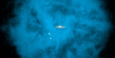 Image of a small spiral galaxy at the center of a spherical blue cloud of gas