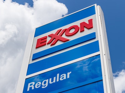 ExxonMobil gas sign set against a cloudy sky