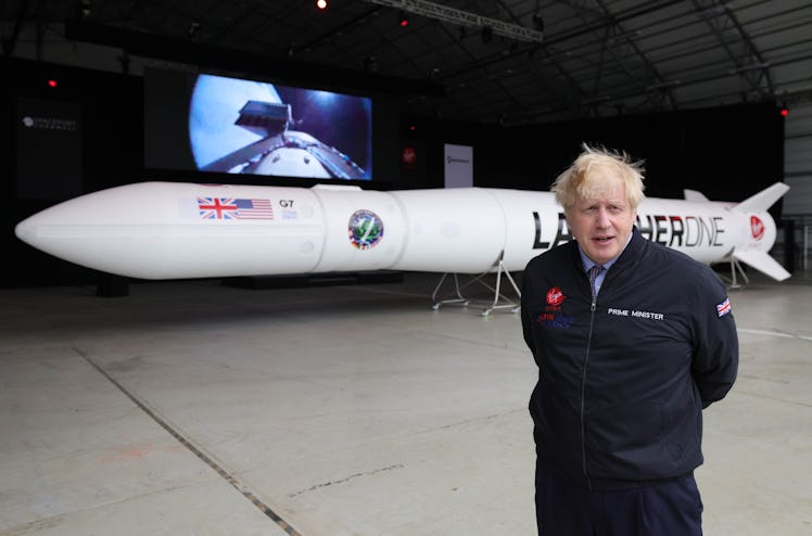 Former U.K. Prime Minister Boris Johnson with the Virgin Orbit LauncherOne rocket.