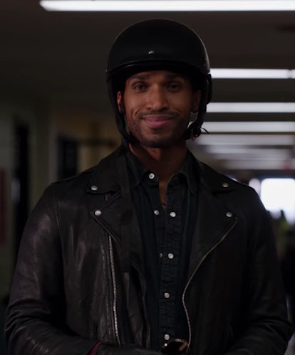 Zion, a Sagittarius played by Nathan Mitchell, smiles while wearing motorcycle gear on Ginny & Georg...