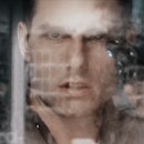 Tom Cruise's character surrounded by sci-fi tech