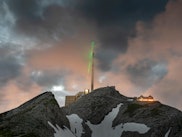 An image of the laser and lightning rod atop a mountain.