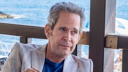 Quentin, whose zodiac sign is Taurus, played by Tom Hollander on a yacht in The White Lotus