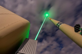 An image of the laser aimed at a lightning rod.