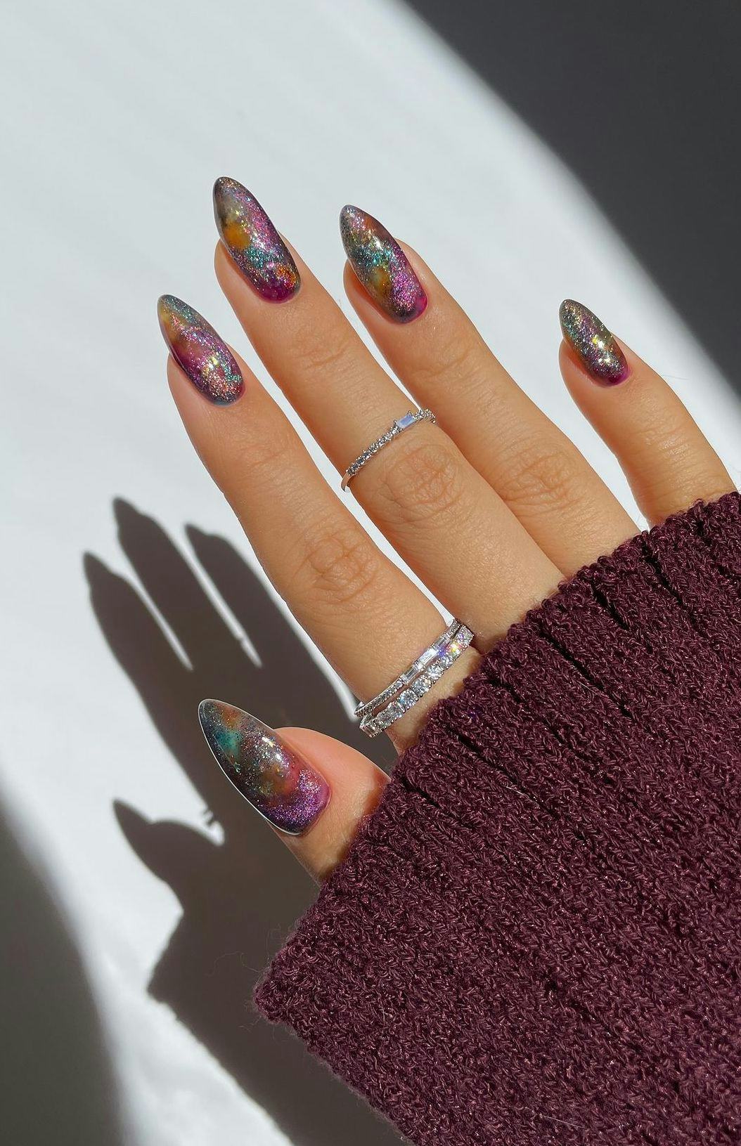 Try holographic glitter nail art for Aquarius season.
