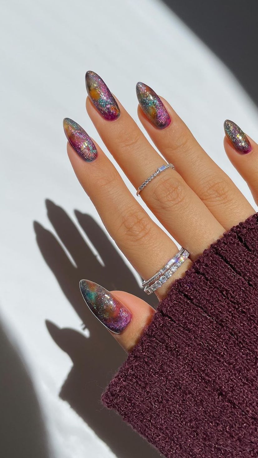 Try holographic glitter nail art for Aquarius season.