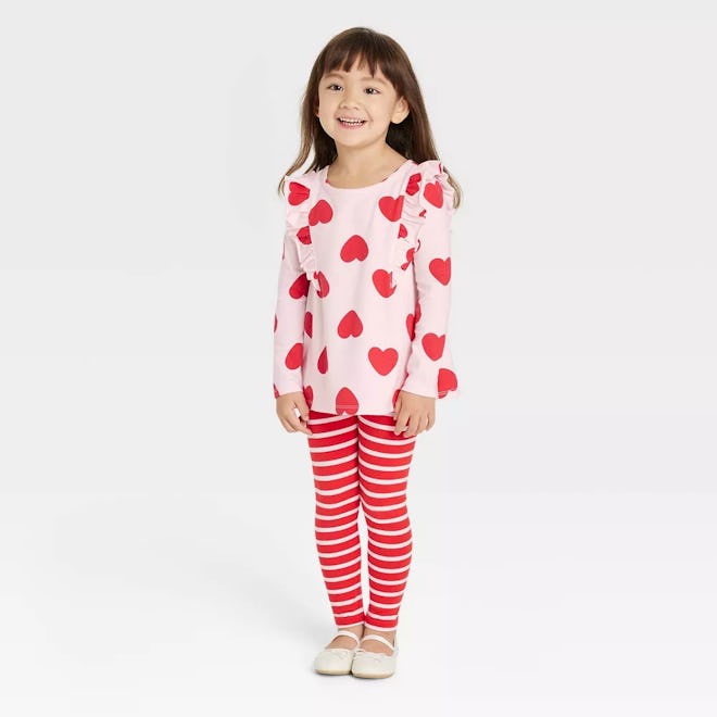 Heart dress with striped leggings, a Valentine's Day outfit for girls