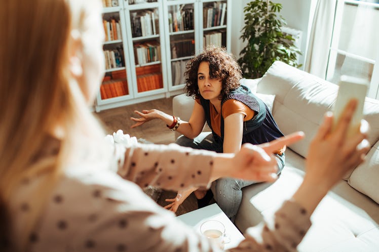 Adult woman on floor arguing with her mother