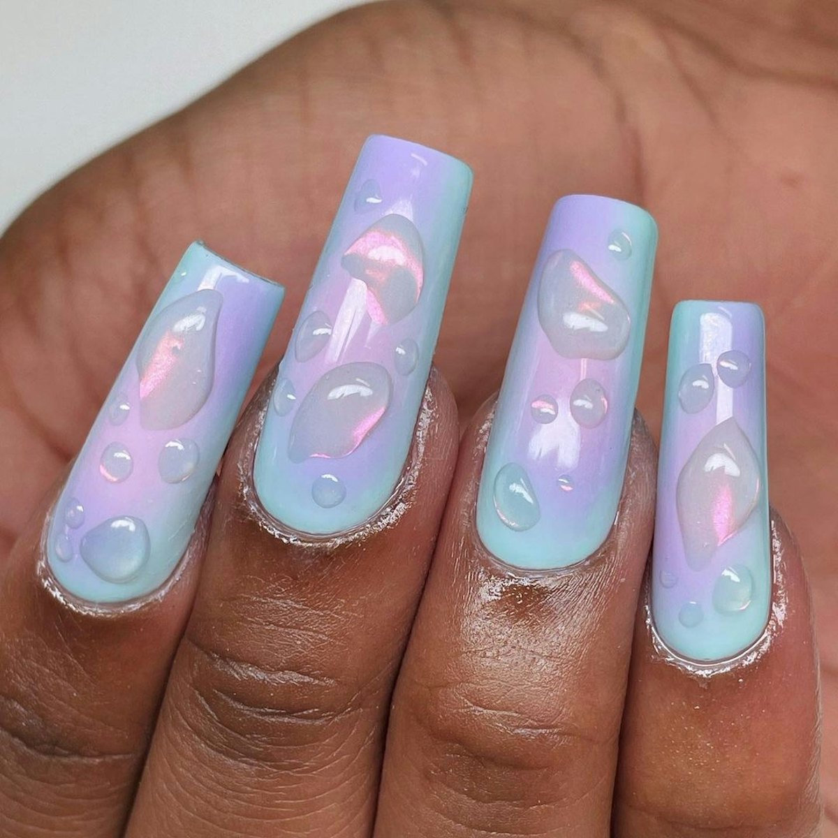 Try mermaid-inspired iridescent nail art for Pisces season.