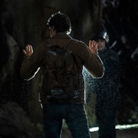 Joel Miller (Pedro Pascal) stands in front of a FEDRA Agent at the end of The Last of Us Episode 1