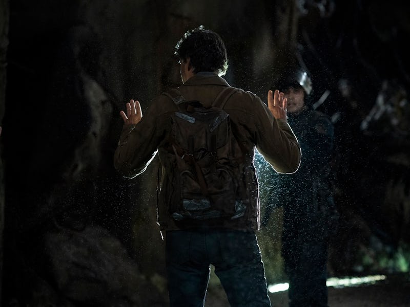 Joel Miller (Pedro Pascal) stands in front of a FEDRA Agent at the end of The Last of Us Episode 1