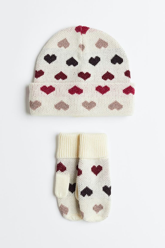 Heart-print beanie and mittens in a story about Valentine's Day outfits for girls